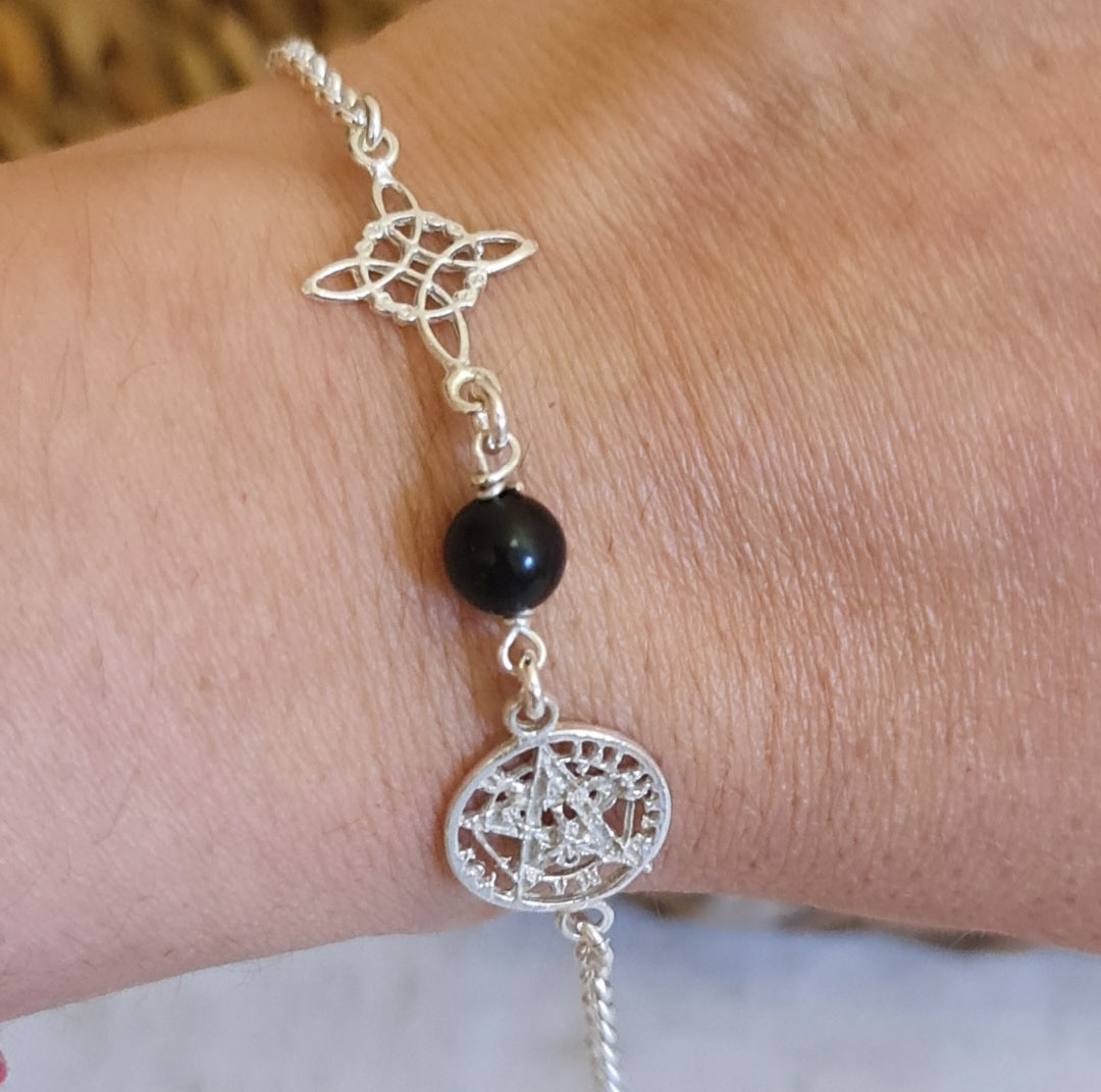 PULSERA PLATA 1 LEY DE TRIPLE PROTECCIÓN (NUDO DE BRUJA,TURMALINA NEGRA Y TETRAGRAMATÓN)